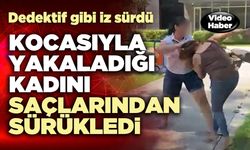 Kocasıyla yakaladığı kadını saçlarından sürükledi
