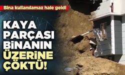 Kaya parçası binanın üzerine çöktü!