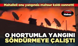 Mahalleli mahsur kaldı zannetti, O hortumla yangını söndürmeye çalıştı