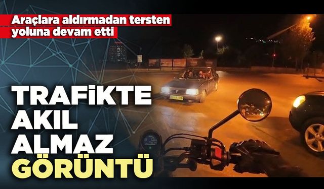 Trafikte akıl almaz görü: Araçlara aldırmadan tersten yoluna devam etti