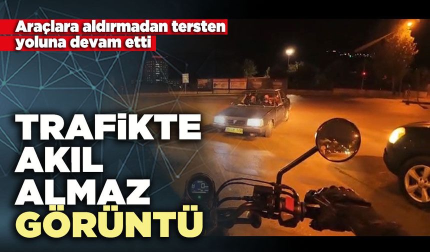 Trafikte akıl almaz görü: Araçlara aldırmadan tersten yoluna devam etti